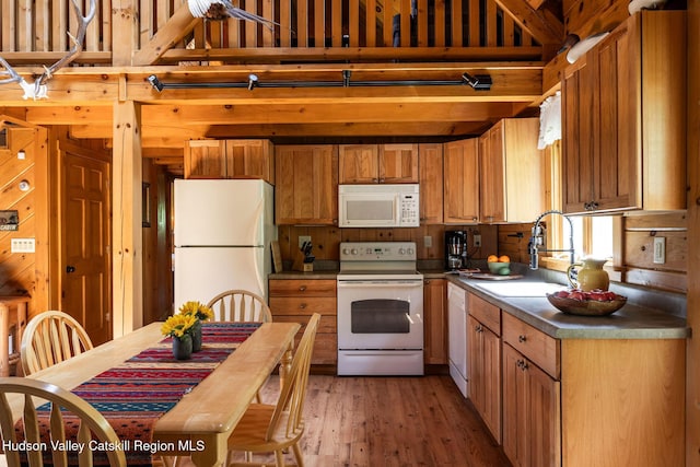 422 Waterview Dr, Andes, NY 13731 - kitchen with white appliances, a sink, light wood finished floors, a towering ceiling, and brown cabinets
