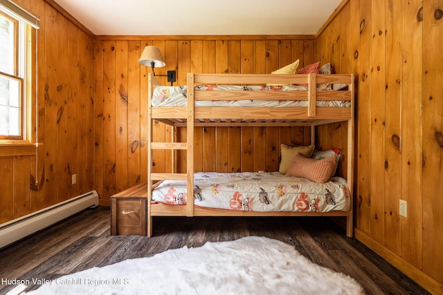 422 Waterview Dr, Andes, NY 13731 - bedroom with wood finished floors, a baseboard heating unit, and wooden walls