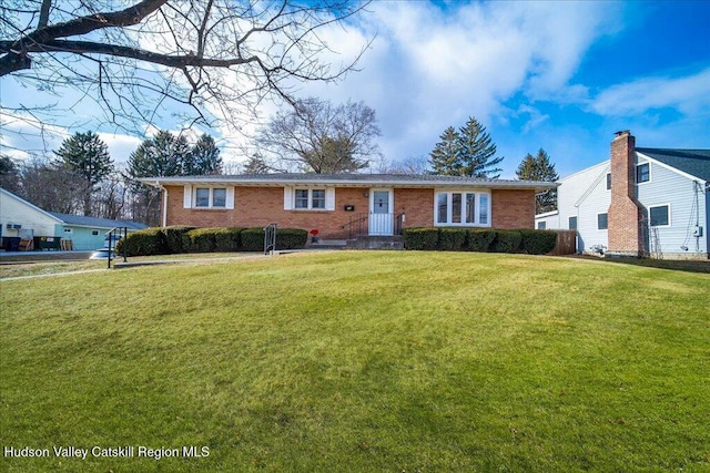 ranch-style home with a front yard