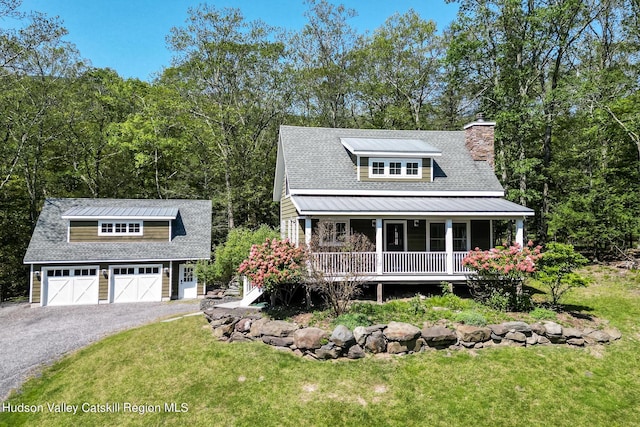 view of front facade with a front lawn and covered porch