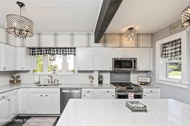 71 Melrose Ave, Albany, NY 12203 - kitchen with appliances with stainless steel finishes, a sink, healthy amount of natural light, white cabinets, and beam ceiling