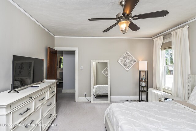 71 Melrose Ave, Albany, NY 12203 - bedroom featuring radiator heating unit, light colored carpet, crown molding, baseboards, and ceiling fan