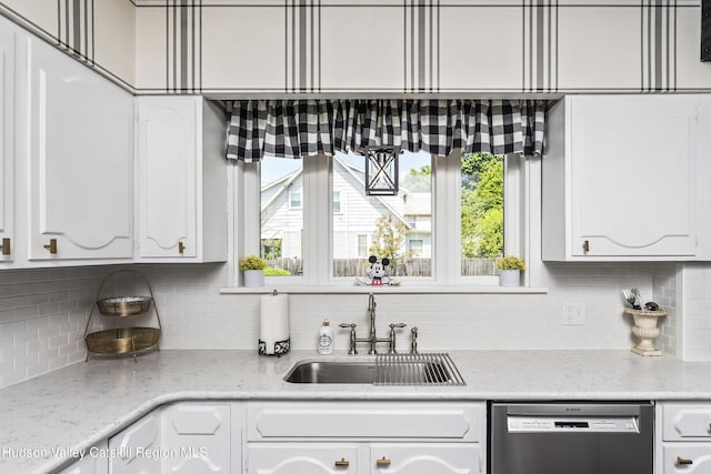71 Melrose Ave, Albany, NY 12203 - kitchen featuring dishwasher, a sink, white cabinets, and backsplash