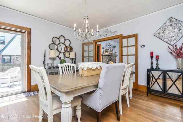 71 Melrose Ave, Albany, NY 12203 - dining space with a chandelier, ornamental molding, and light wood finished floors