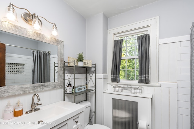 71 Melrose Ave, Albany, NY 12203 - bathroom featuring toilet, vanity, a wainscoted wall, and curtained shower