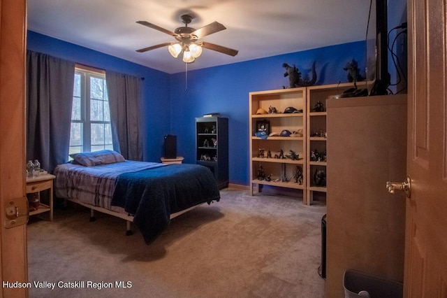 carpeted bedroom featuring ceiling fan