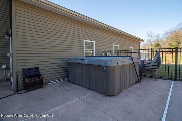 view of patio / terrace with a hot tub