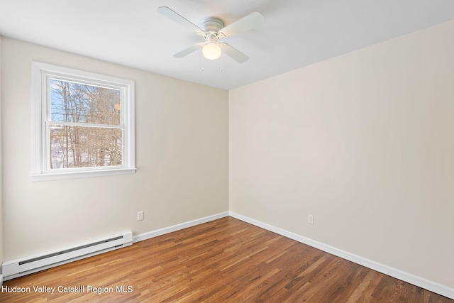 unfurnished room featuring a baseboard heating unit, wood-type flooring, and ceiling fan