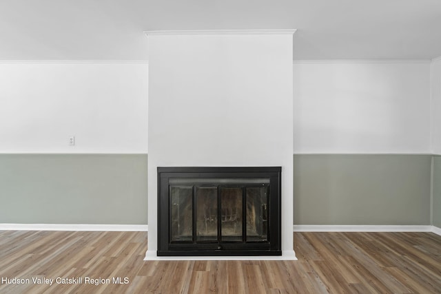 details featuring crown molding and hardwood / wood-style flooring