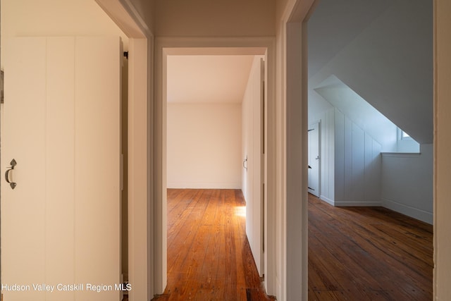 hallway featuring dark hardwood / wood-style flooring