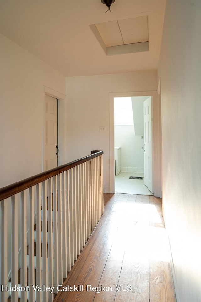 hall with light hardwood / wood-style flooring