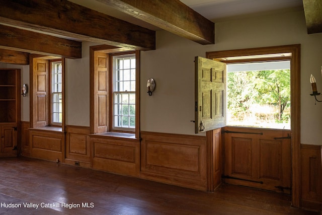 entryway featuring beamed ceiling and dark wood-type flooring