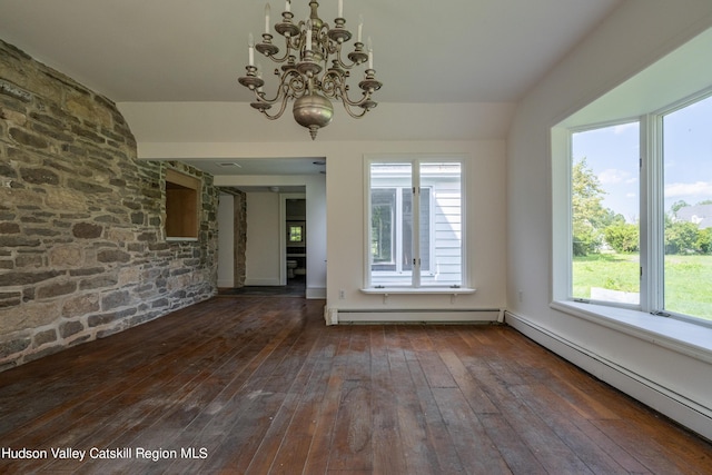 empty room featuring dark wood-type flooring, plenty of natural light, a baseboard radiator, and an inviting chandelier