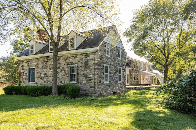 view of home's exterior featuring a lawn