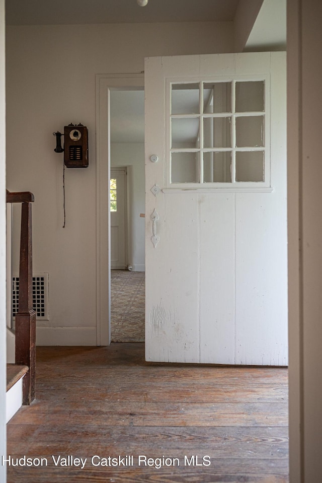 hallway featuring wood-type flooring