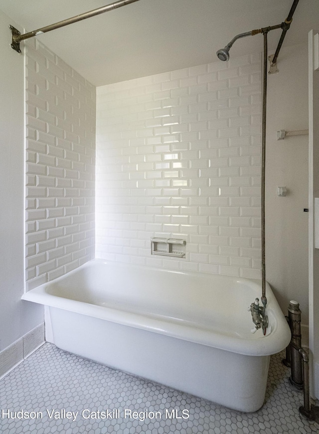 bathroom featuring a bathtub and tile patterned flooring