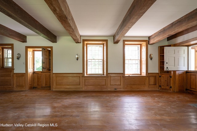 foyer featuring beamed ceiling and dark wood-type flooring