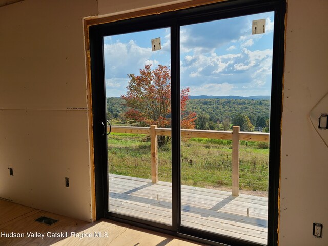 doorway to outside with light hardwood / wood-style floors