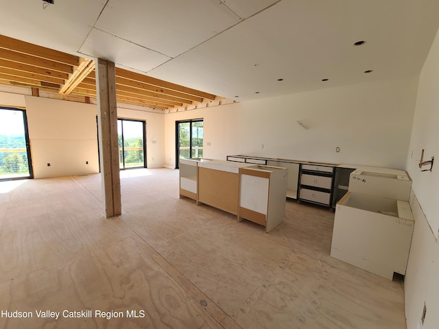 kitchen featuring a center island and white cabinetry