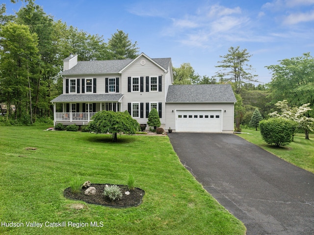 20 Cedar Ridge Rd, Stone Ridge, NY 12484 - colonial inspired home with a chimney, asphalt driveway, an attached garage, a front lawn, and a porch