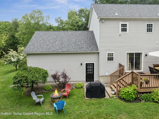 20 Cedar Ridge Rd, Stone Ridge, NY 12484 - back of property featuring an outdoor fire pit, a deck, a yard, and roof with shingles