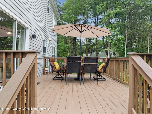 20 Cedar Ridge Rd, Stone Ridge, NY 12484 - wooden deck featuring outdoor dining area and view of wooded area