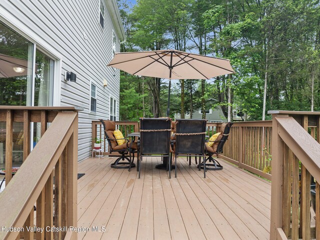 20 Cedar Ridge Rd, Stone Ridge, NY 12484 - wooden deck featuring outdoor dining area and view of wooded area