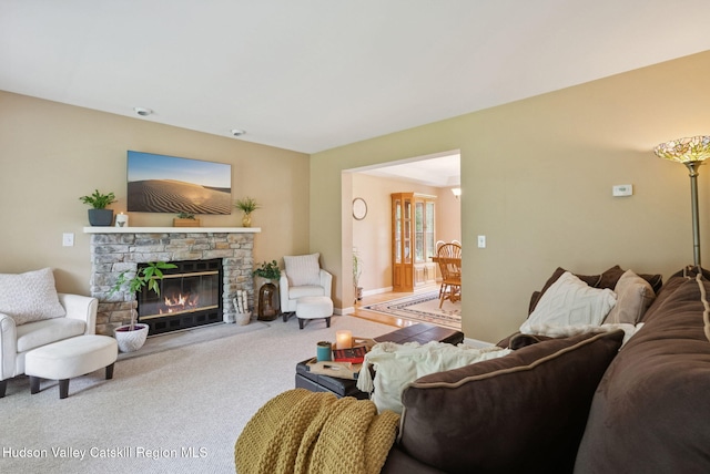 20 Cedar Ridge Rd, Stone Ridge, NY 12484 - carpeted living room with a stone fireplace and baseboards