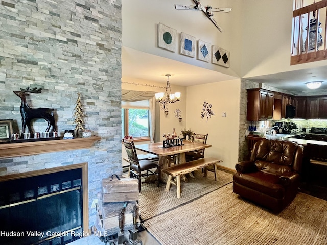 82 Liftside Dr Unit A13, Hunter, NY 12442 - dining room with a chandelier, baseboards, and a high ceiling