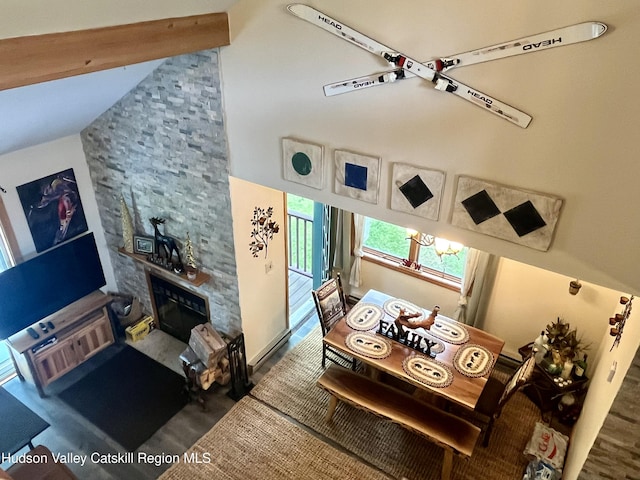 82 Liftside Dr Unit A13, Hunter, NY 12442 - dining space featuring vaulted ceiling, a stone fireplace, and carpet