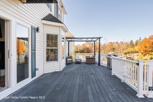 wooden deck featuring a pergola