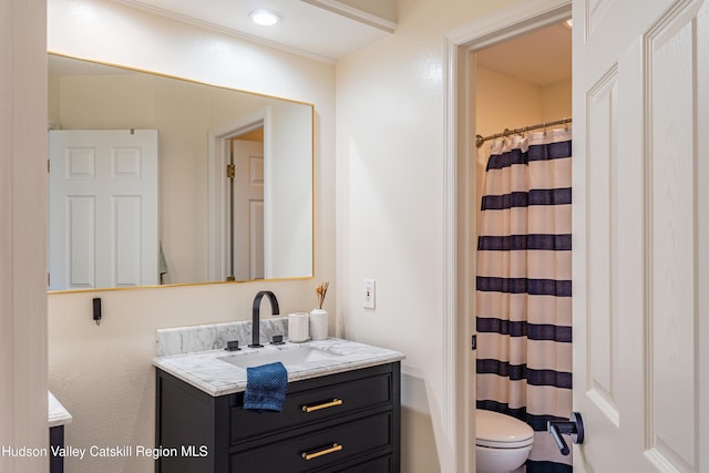 bathroom with vanity and toilet