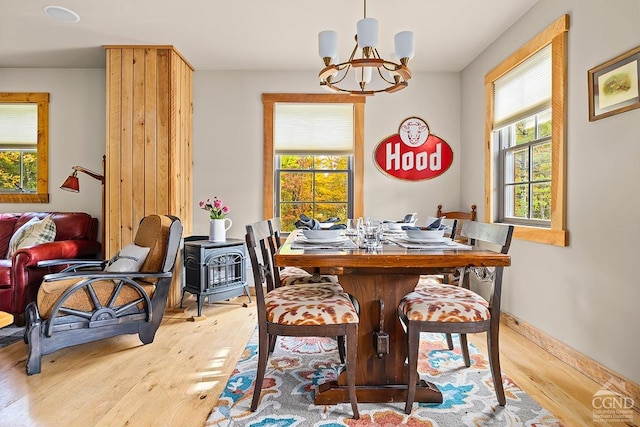 214 Fog Hill Rd, Austerlitz, NY 12017 - dining room with a chandelier, wood finished floors, plenty of natural light, and baseboards