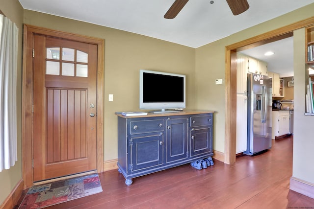 foyer entrance with dark hardwood / wood-style floors and ceiling fan