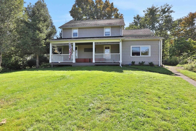 view of front of house featuring covered porch and a front yard