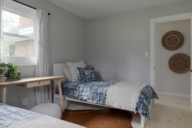 bedroom with light hardwood / wood-style floors