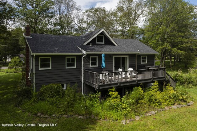 rear view of house with a wooden deck