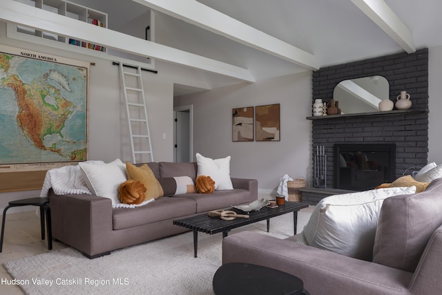 living room featuring beam ceiling and a fireplace