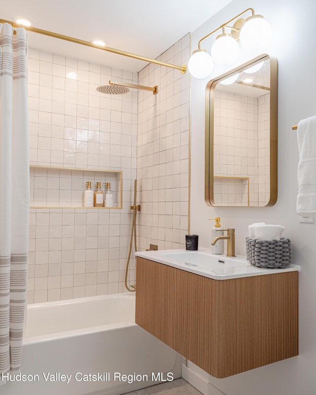 bathroom featuring vanity and shower / tub combo with curtain