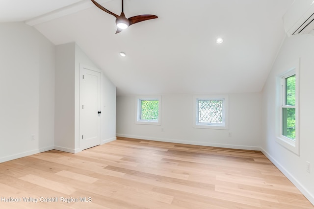 bonus room with light hardwood / wood-style floors, plenty of natural light, lofted ceiling, and ceiling fan