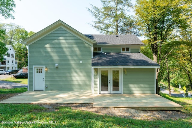 rear view of property featuring a patio area and french doors