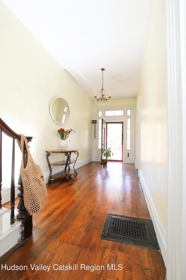 604 Columbia St, Hudson, NY 12534 - entrance foyer featuring hardwood / wood-style flooring, a chandelier, and baseboards