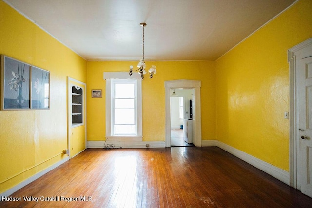 604 Columbia St, Hudson, NY 12534 - spare room featuring hardwood / wood-style flooring, a chandelier, and baseboards