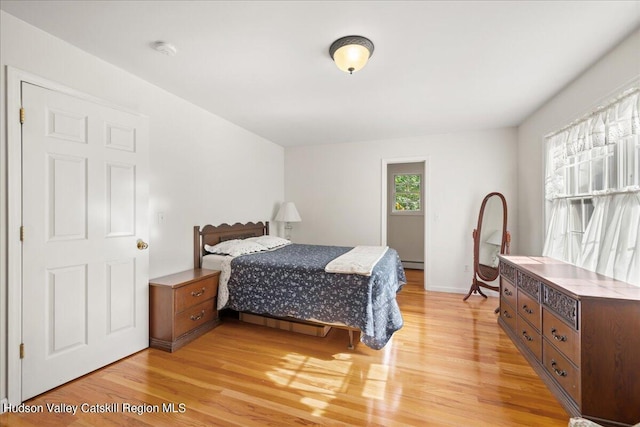 bedroom with light hardwood / wood-style flooring