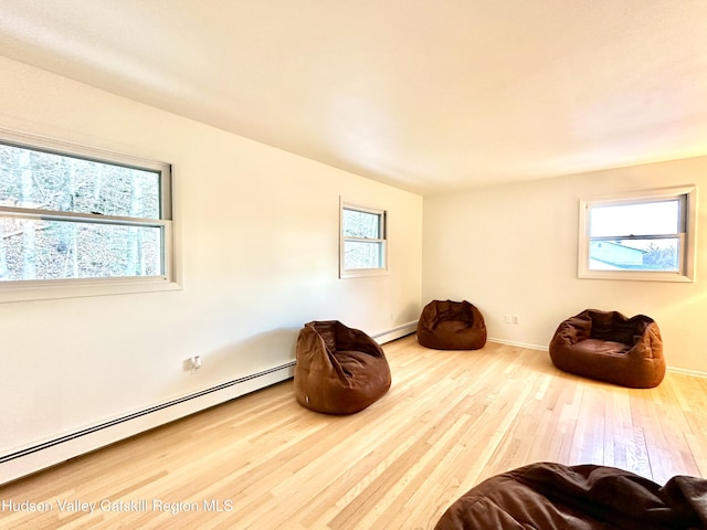 32 Redwood Rd, Saugerties, NY 12477 - living area featuring baseboards, a baseboard radiator, and hardwood / wood-style floors
