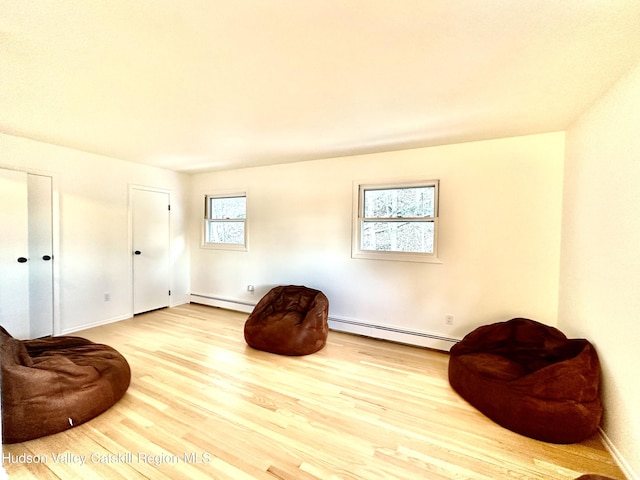 32 Redwood Rd, Saugerties, NY 12477 - sitting room with a baseboard heating unit and wood finished floors