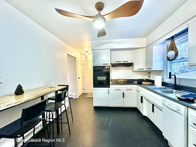 32 Redwood Rd, Saugerties, NY 12477 - kitchen featuring white cabinets, under cabinet range hood, oven, white dishwasher, and a sink