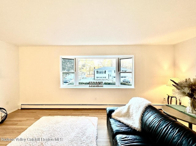 32 Redwood Rd, Saugerties, NY 12477 - living area featuring baseboard heating, a baseboard radiator, and wood finished floors