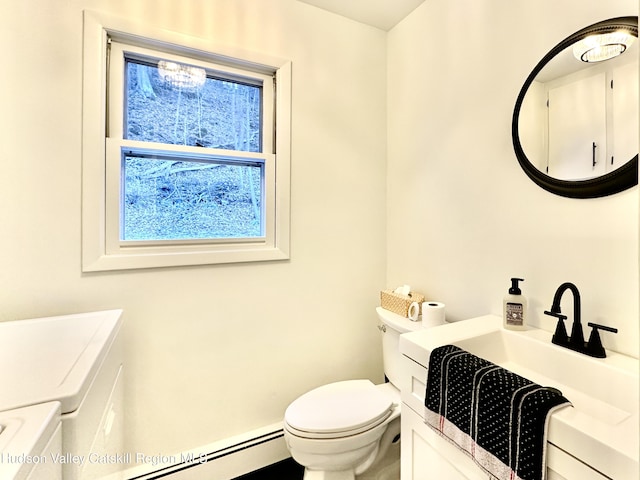 32 Redwood Rd, Saugerties, NY 12477 - half bathroom with baseboard heating, a sink, and toilet