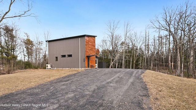 view of home's exterior featuring an outdoor structure